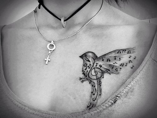Flying Bird Music Notes Tattoo On Front