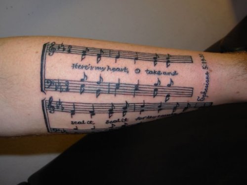 Grey Ink Music Tattoo On Arm