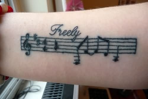 Black Ink Music Tattoo On Right Forearm