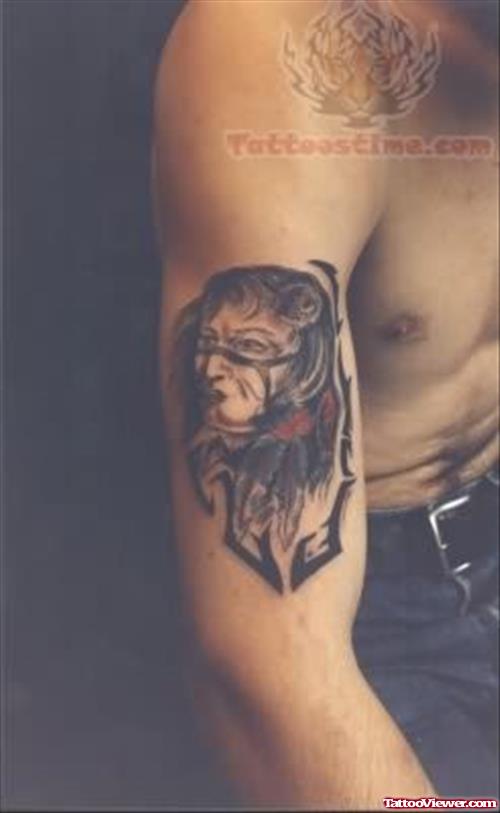 Guy Showing Native American Tattoo On Biceps