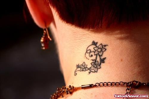 Tiny Flower Back Neck Tattoo