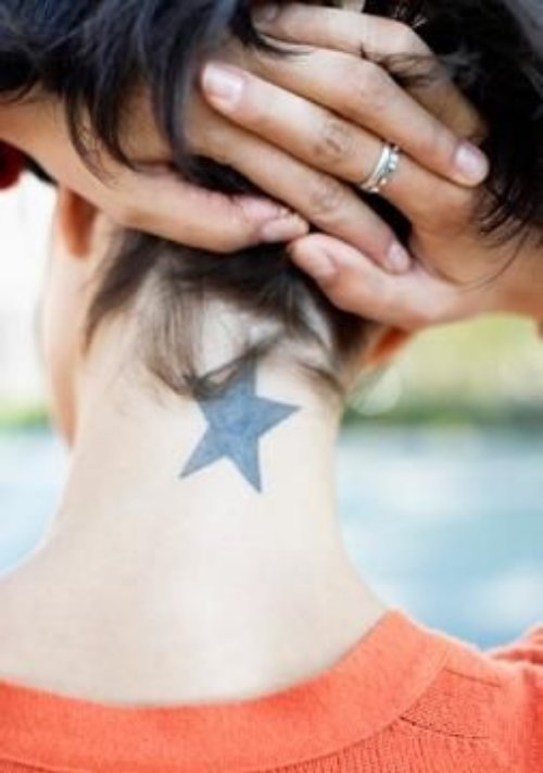 Black Star Tattoo On Back Neck