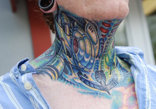 Colored Ink Biomechanical Neck Tattoo