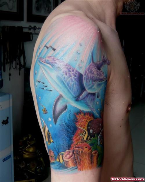 Blue Ocean And Dolphin Tattoo