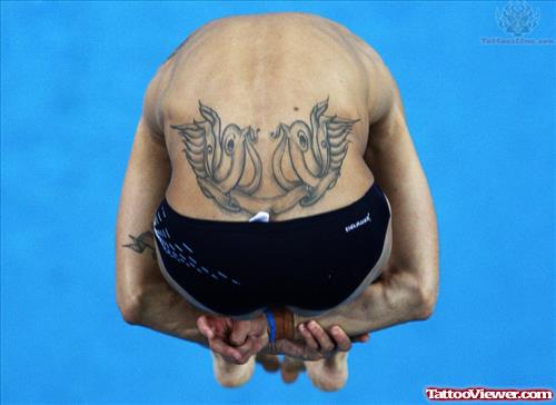 Olympic Athlete Showing Birds Tattoos On Lower Back