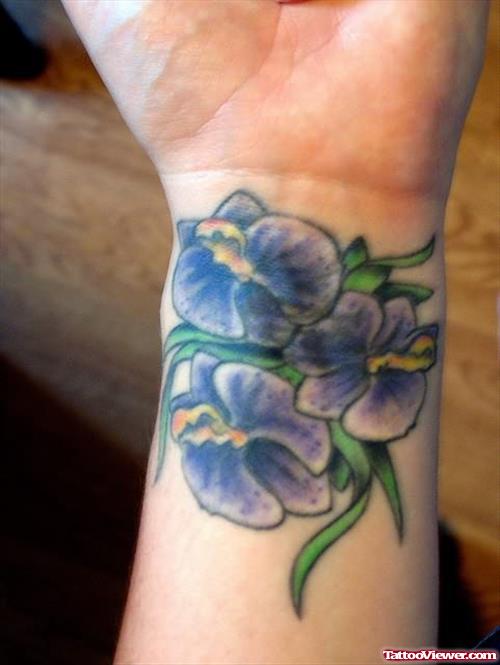 Purple Ink Orchid Flower Tattoo On Wrist