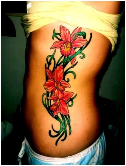 Black Tribal And Orchid Flowers Tattoos On Side Rib