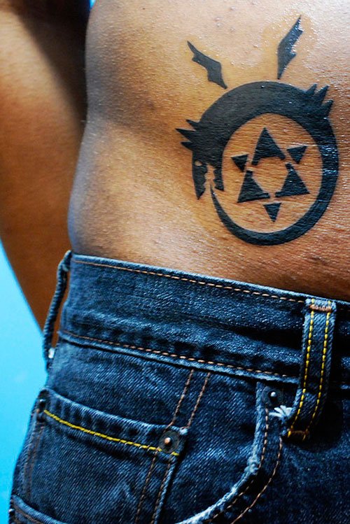 Best Black Ink Star And Ouroboros Tattoo On Right Hip