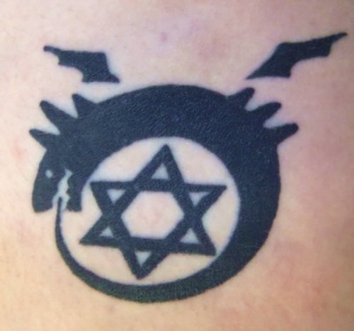 Amazing Black Ink Star And Ouroboros Tattoo