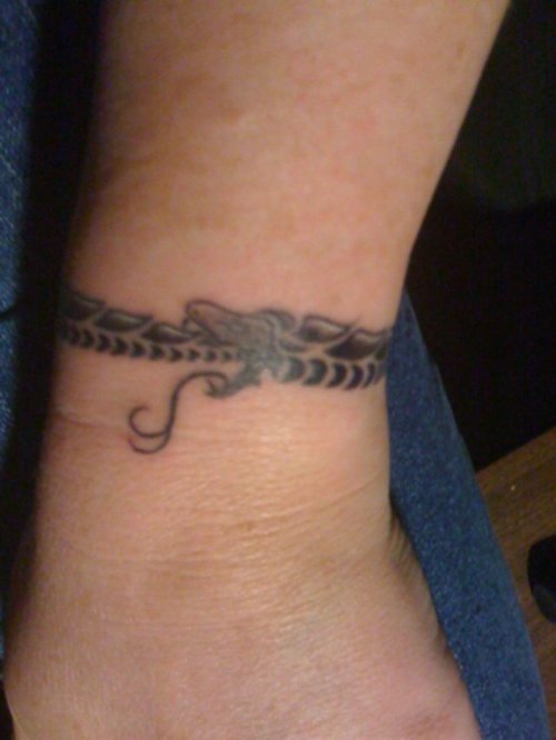 Grey Ink Snake Ouroboros Tattoo On Left Wrist