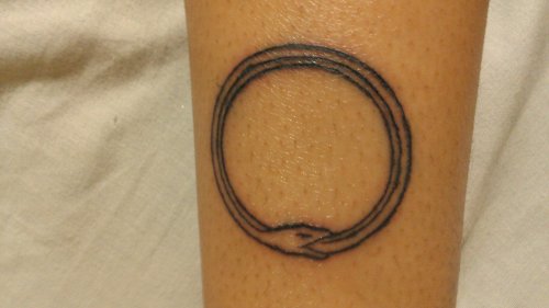 Amazing Grey Ink Ouroboros Tattoo On Arm