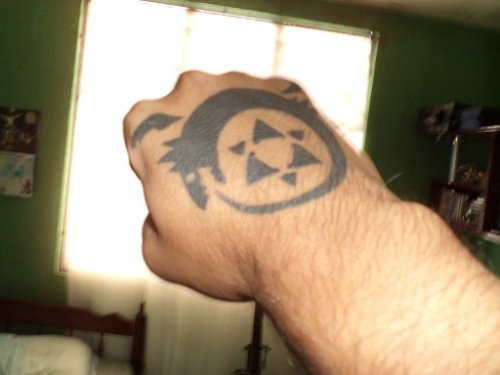 Ouroboros Tattoo On Right Hand