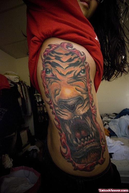 Ripped Skin Panther Head Tattoo On Side Rib