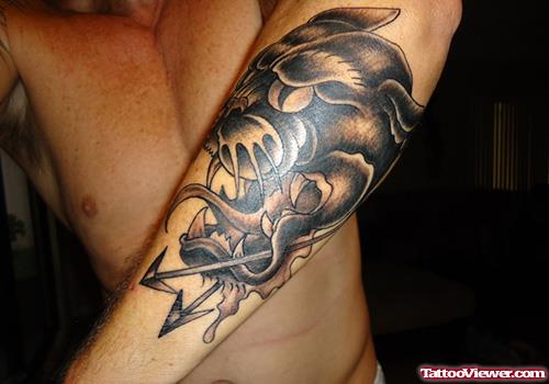 Grey Ink Panther Head With Arrow Tattoo On Left Sleeve