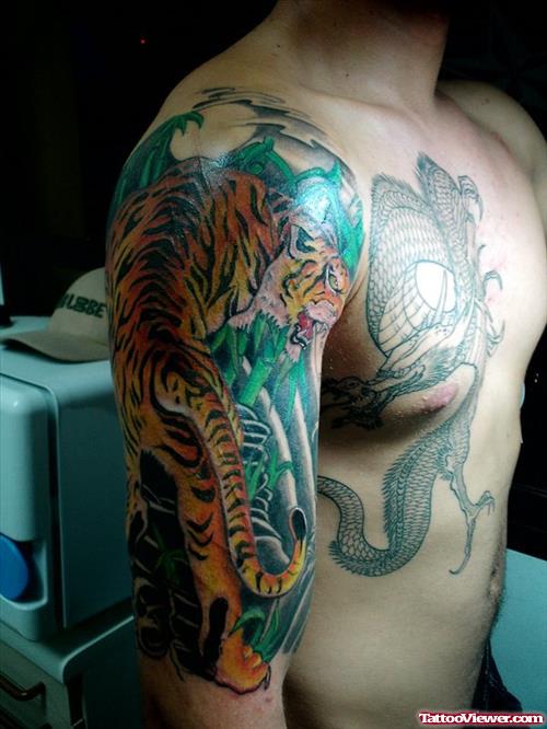 Dragon Tattoo On Chest And Panther Tattoo On Half Sleeve