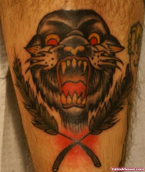 Panther Head And Feather Tattoo