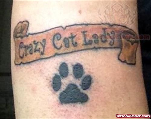 Paw Prints And Banner Tattoo