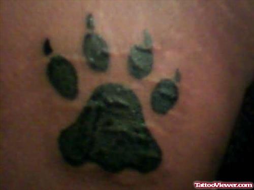 Black Ink Wolf Paw Tattoo