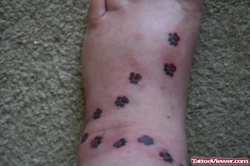 Tiny Paw Prints Tattoos On Foot