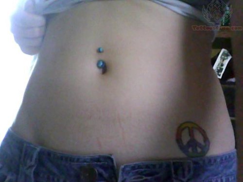 Peace Tattoo On Hip And Belly Piercing