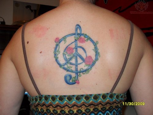 Peace And Treble Tattoo On Back