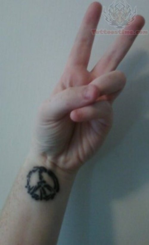 Large Wrist Peace Tattoo