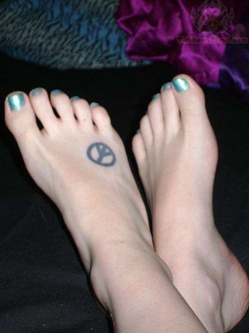 Peace Sign On Foot Tattoo