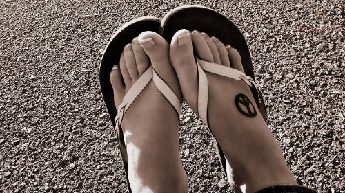 Peace Sign Tattoo On Girl Right Foot