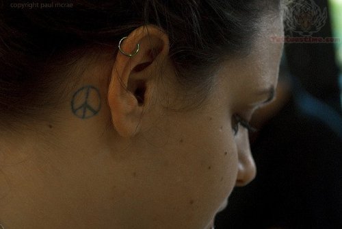 Small Peace Symbol Tattoo Behind Ear