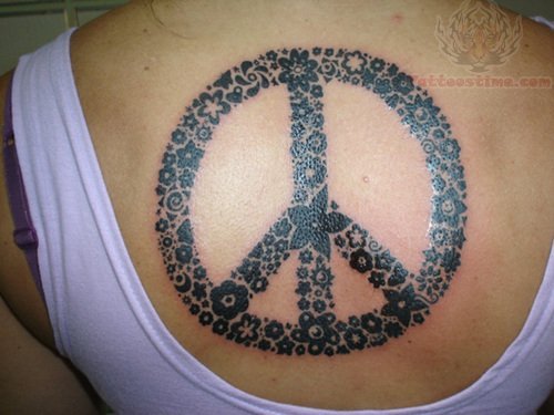 Small Flowers Peace Sign Tattoo On Upperback