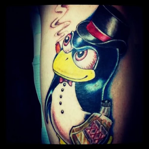Left Sleeve Color Penguin Tattoo