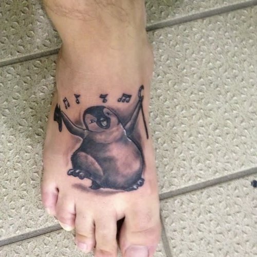 Grey Ink Singing Penguin Tattoo On Right Foot