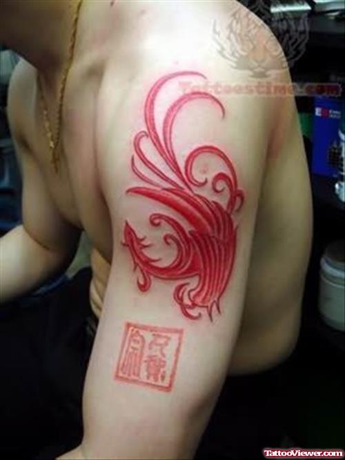 Colored Phoenix Tattoo On Bicep