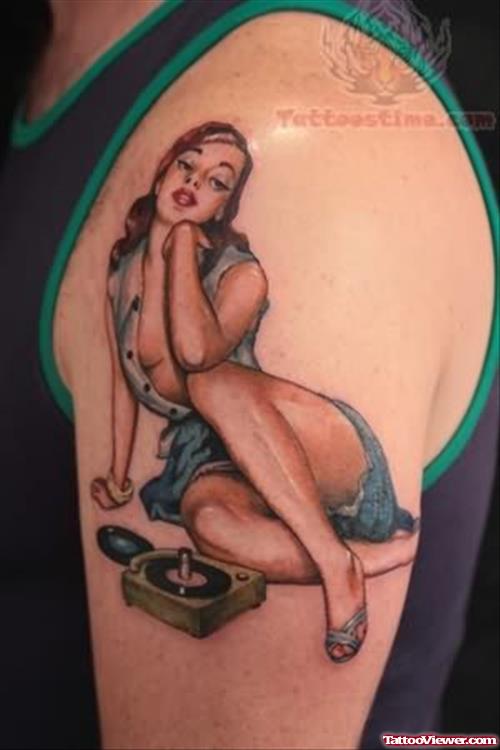 Pin Up Girl Sitting Tattoo On Shoulder