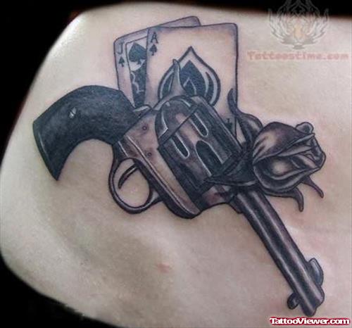 Black And Grey Pistol Tattoo