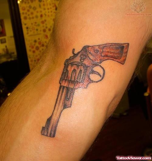 Pistol Tattoo On Elbow