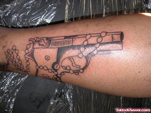 Complete Pistol Tattoo On Arm