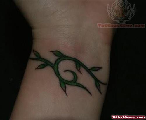 Green Leave Tattoo On Wrist