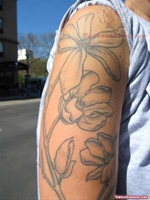 Magnolia Tattoo On Biceps