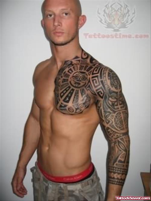 Polynesian Tattoo On Arm And Chest