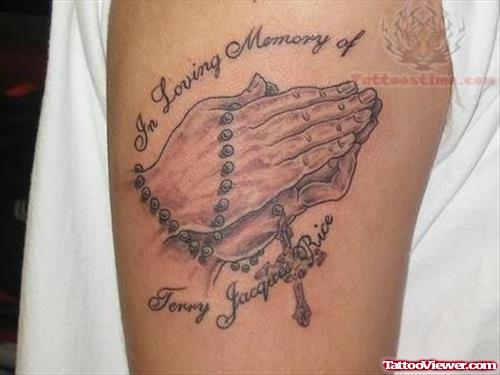 Rosary Hands Tattoo On Muscle