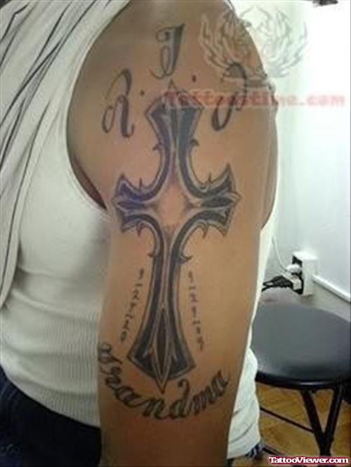 Large Cross Tattoo On Bicep