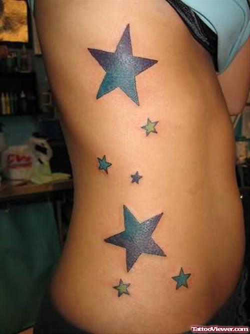 Large Stars Tattoos On Rib