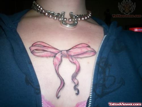 Bow Tattoo On Chest
