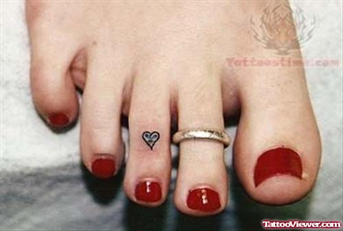 Small Heart Ring Tattoo