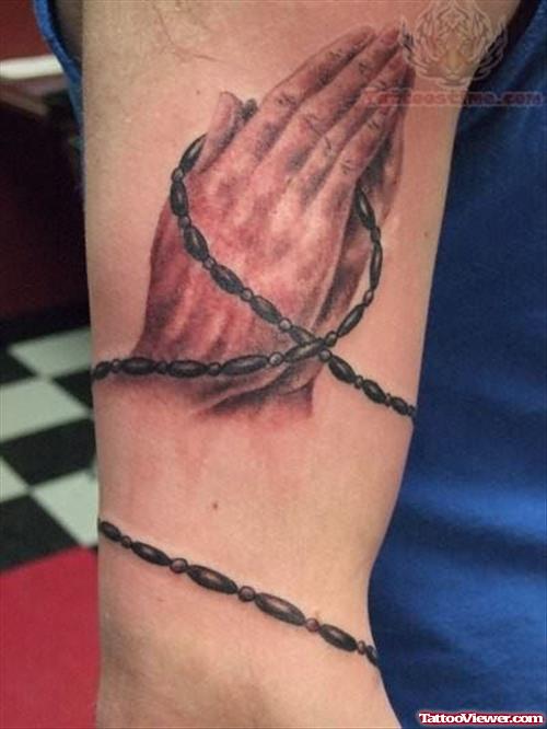 Black Rosary Tattoo On Muscle