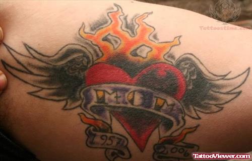 Winged Sacred Heart Tattoo On Muscles