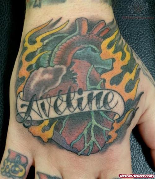 Aveline Sacred Heart Tattoo On Hand