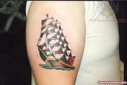 Small Ship Tattoo On Bicep