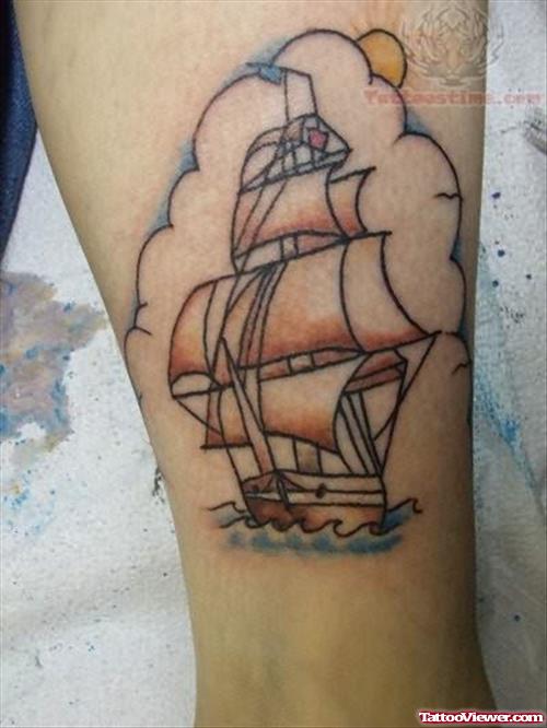 Sun And Small Ship Tattoo